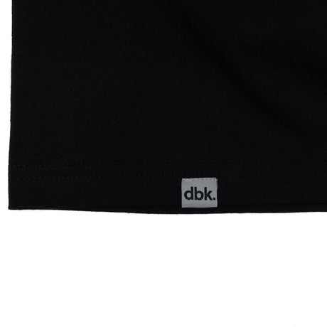 Black tank top hem with dbk label tag centered.