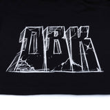 Black T-shirt close-up of large white graphic lettering across chest