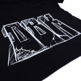 Black T-shirt close-up of large white graphic lettering print