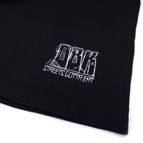 Black T-shirt close-up of white logo text and graphic lettering