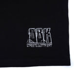 Black T-shirt close-up of white logo text print near hem