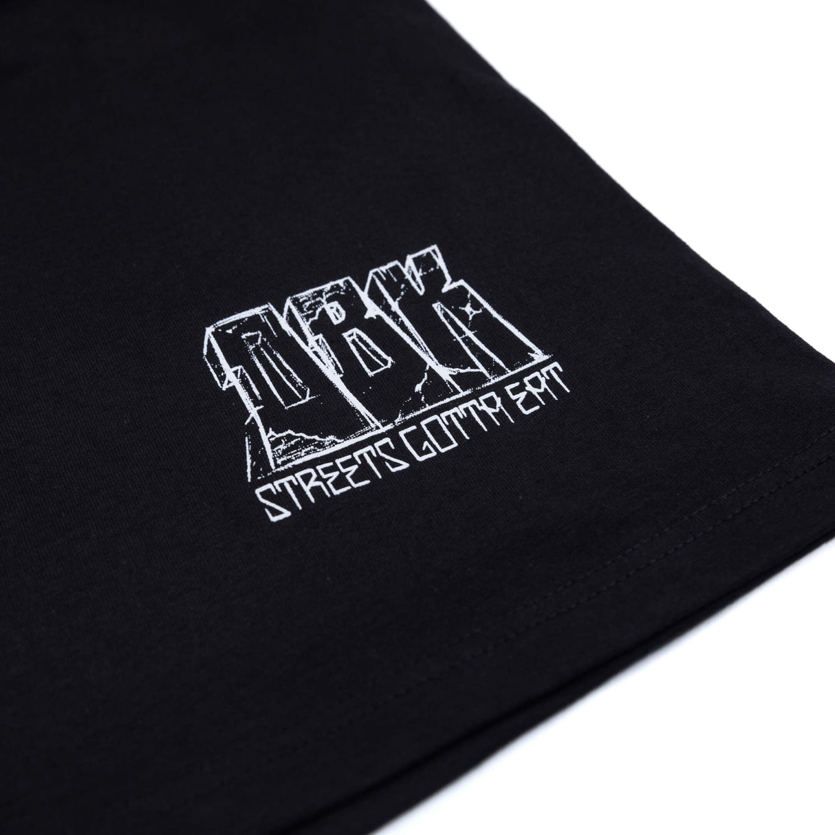 Black T-shirt close-up of small white logo print