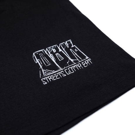 Black T-shirt close-up of small white logo print