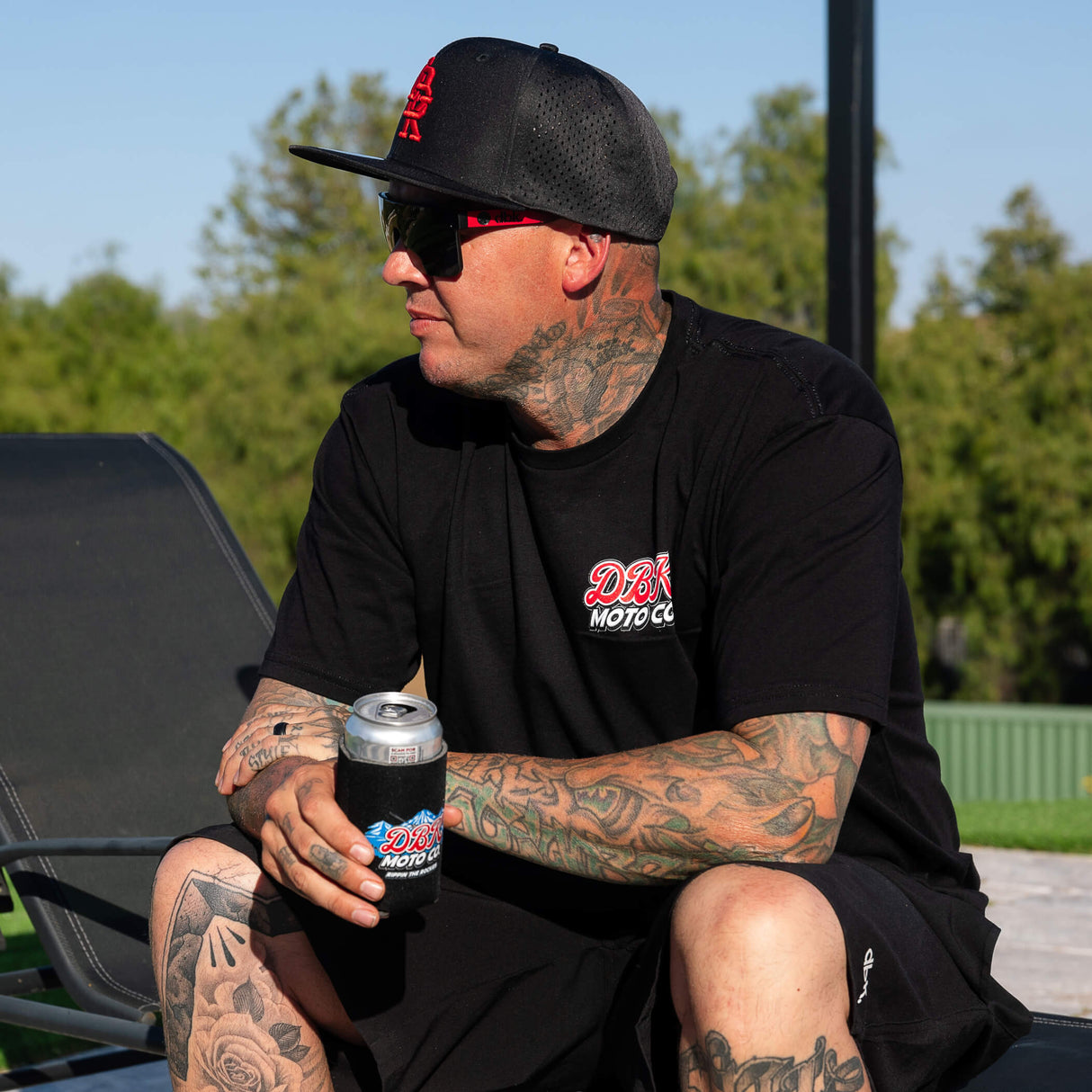 Black crewneck tall T-shirt with small red-and-white chest logo