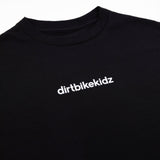 Black crewneck tee close-up: white 'dirtbikekidz' chest print