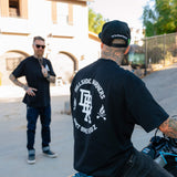 Black T-shirt back graphic with flame icons and bold center logo