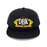 Black trucker hat with DBK logo on crown, curved brim and breathable mesh back