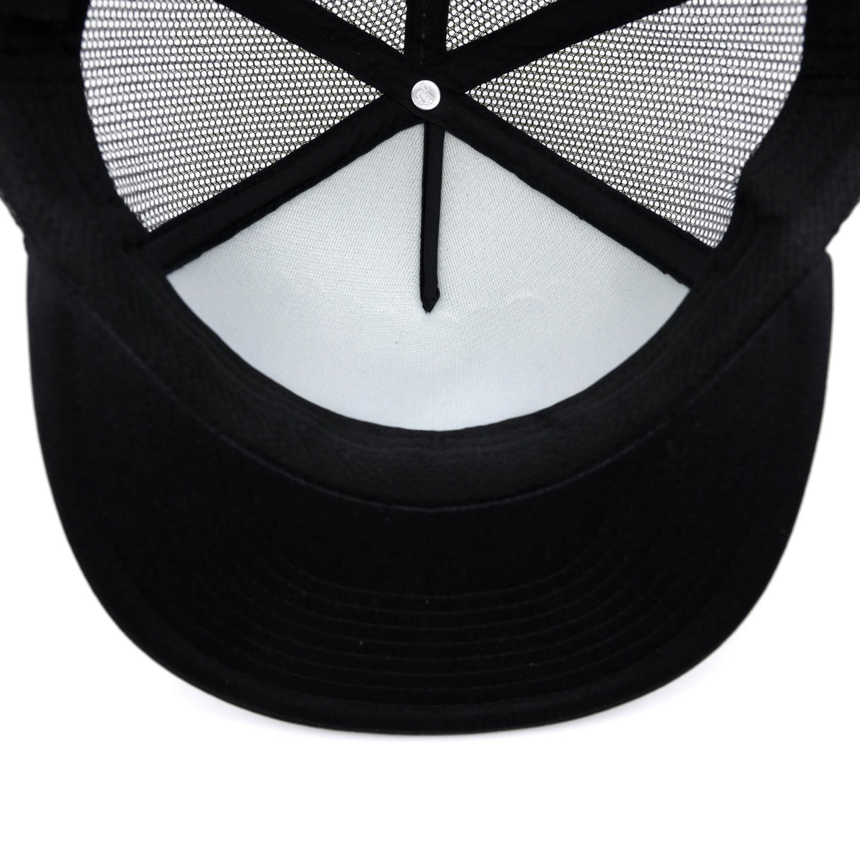 Black trucker hat underside with curved brim and mesh back openings