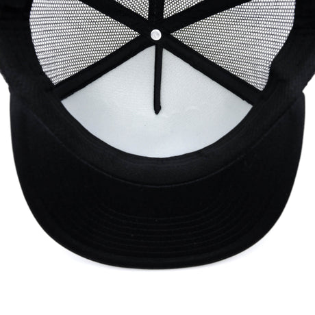 Black trucker hat underside with curved brim and mesh back openings