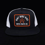 Black and white mesh trucker hat with orange logo patch front.