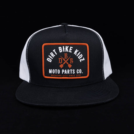 Black and white mesh trucker hat with orange logo patch front.