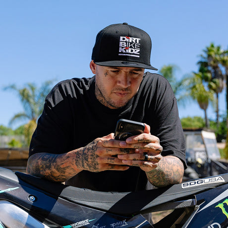 Black snapback hat with Dirt Bike Kidz logo on the front.