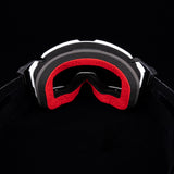 Helios goggle front view with black frame and red inner foam