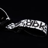 Helios goggles side view with white-and-black patterned strap and silver lens