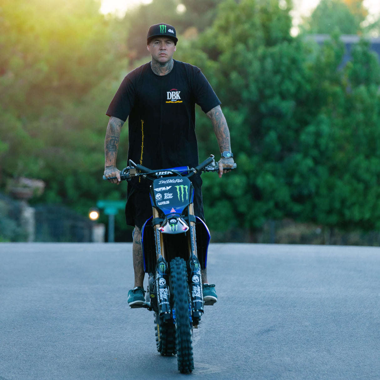 Black graphic tee with small DBK front logo, worn by rider