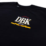 Black T-shirt back detail with vertical yellow lettering and small DBK emblem near shoulder
