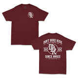 Burgundy graphic T-shirt with chest logo and slogan print