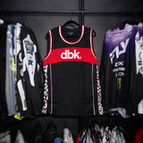 Black jersey tank with red chest band and white-red neckline and armhole trim.