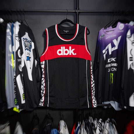 Black jersey tank with red chest band and white-red neckline and armhole trim.