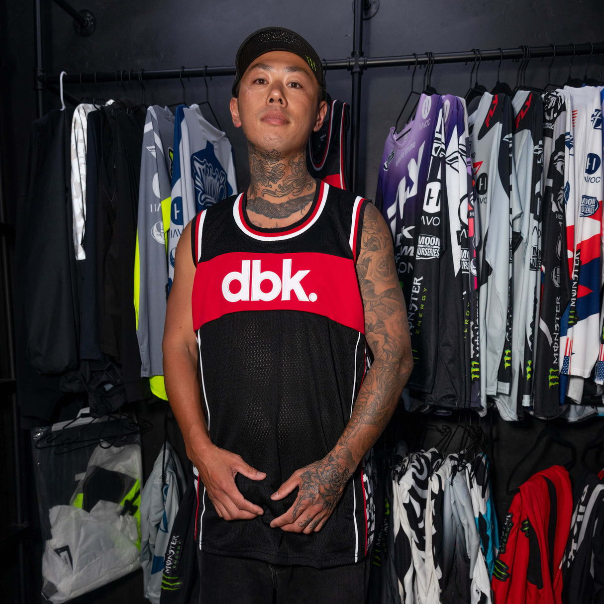 AirMax jersey tank worn on model: black mesh body, red dbk band, white/black trim