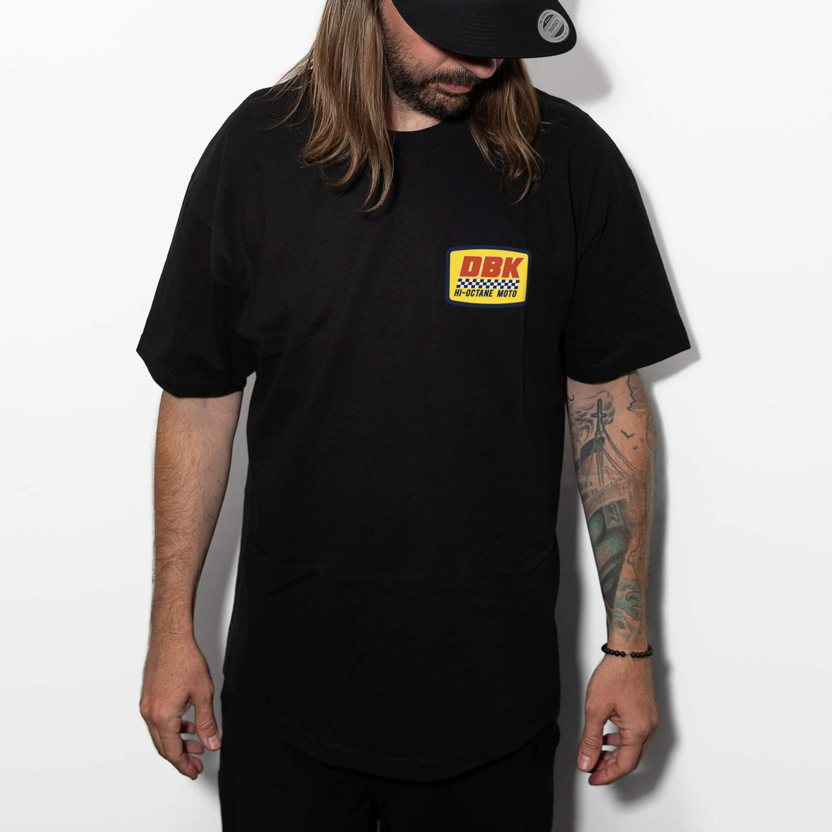 Black crewneck T-shirt worn by model, DBK Hi-Octane Moto chest logo