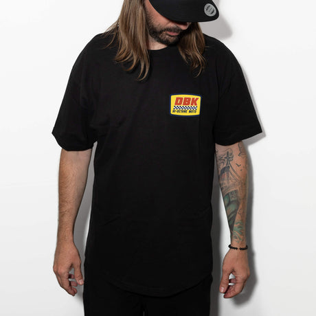 Black crewneck T-shirt worn by model, DBK Hi-Octane Moto chest logo