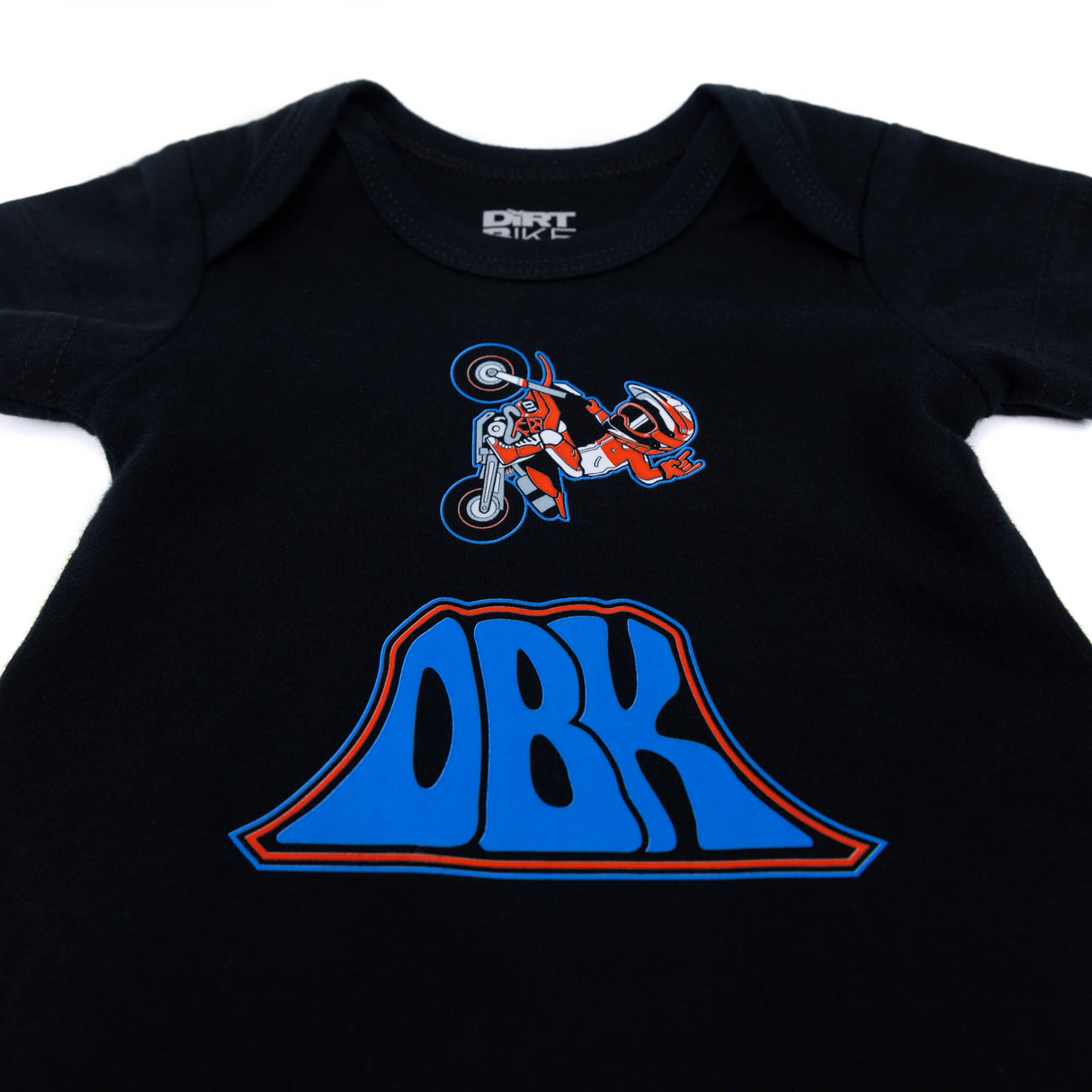 Black baby onesie close-up with motocross rider and large blue ORB graphic