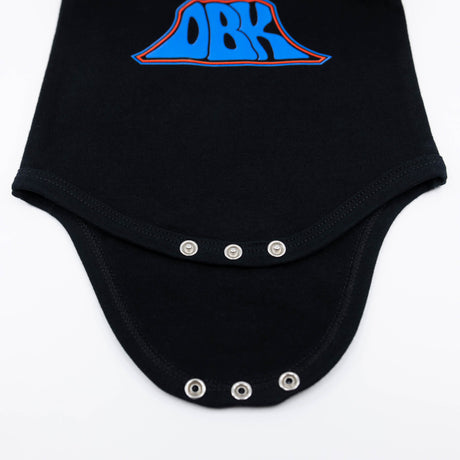Black baby bodysuit with snap buttons along the front panel and legs