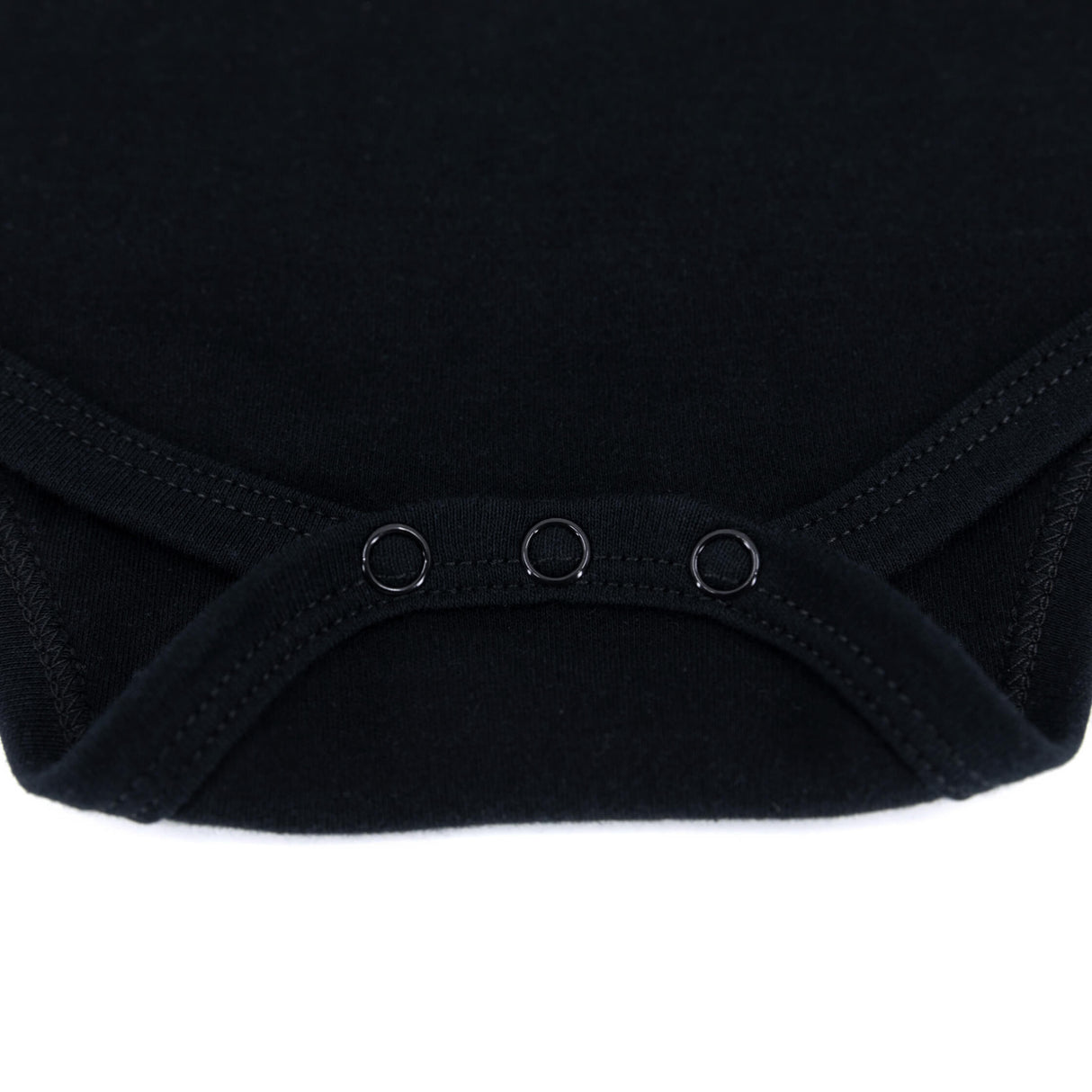 Black baby onesie close-up of leg opening with three snap buttons