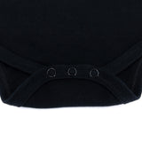 Black baby bodysuit with three metal snap rings at leg opening