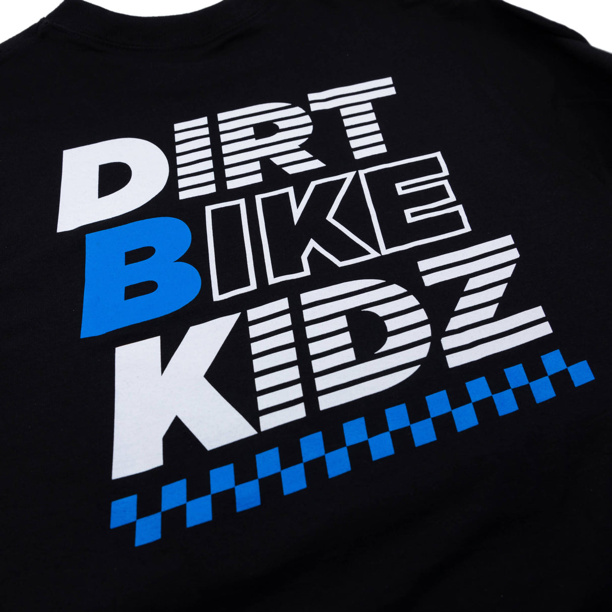 Black crewneck T-shirt chest graphic close-up with white text and blue details