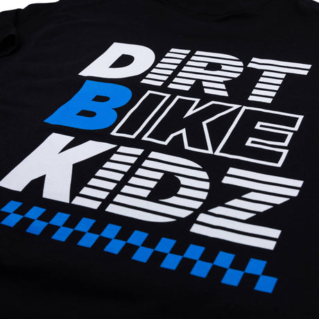 Black Balance Tee graphic close-up: DRV BIKE KIDZ and blue check band.