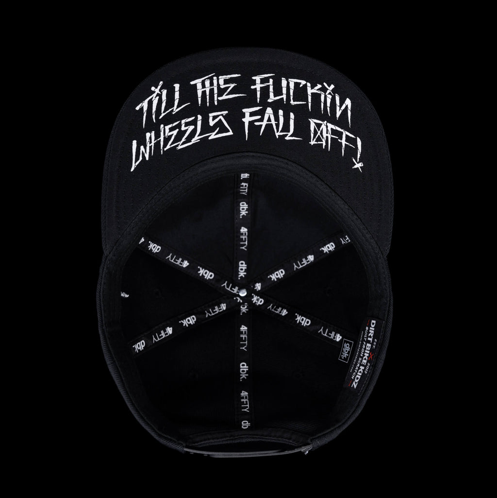 Black snapback cap interior with circular white graphic and text