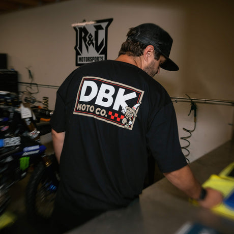 Black T-shirt worn, back view with large DBK Moto Co. graphic logo.