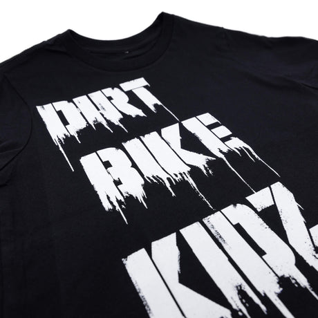 Black graphic T-shirt close-up of white 'DIRT BIKE' print over the chest