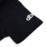 Black T-shirt sleeve with white 'di' logo print