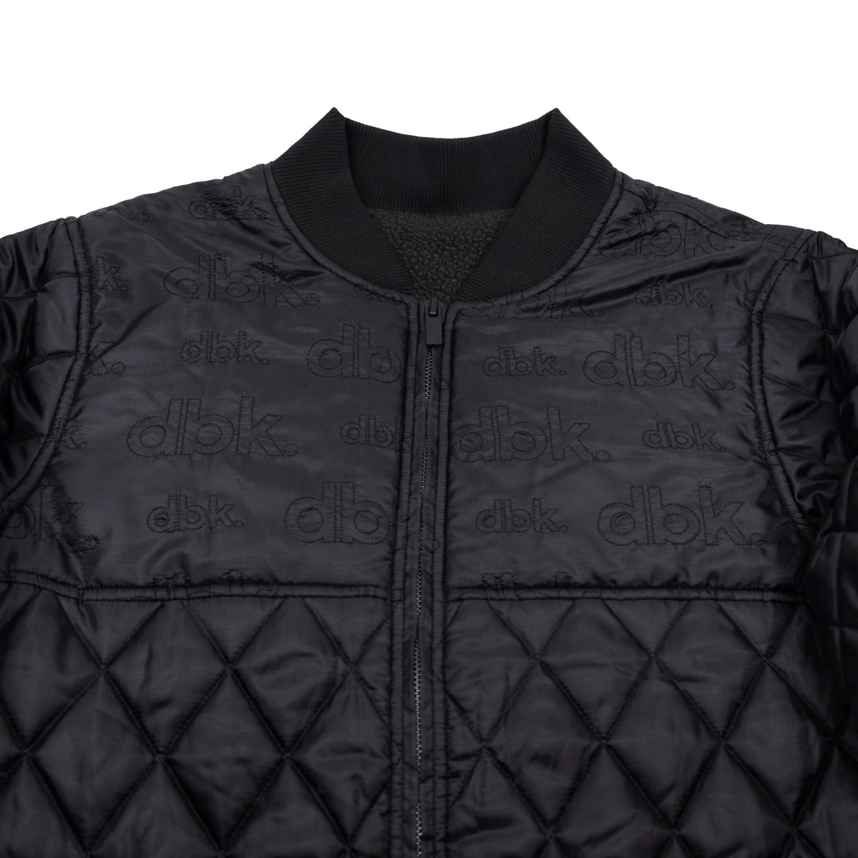 Premium jacket front with stand collar, full-zip, repeating dbk logo, and diamond quilting