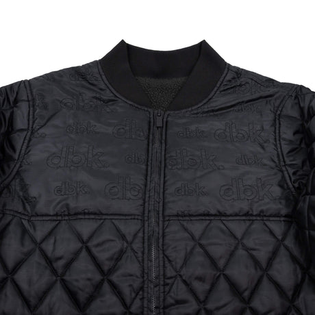 Premium jacket front with stand collar, full-zip, repeating dbk logo, and diamond quilting