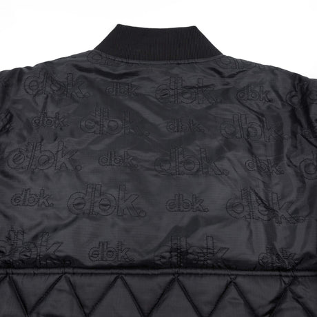Premium jacket back with repeating dbk logo print and quilted diamond paneling