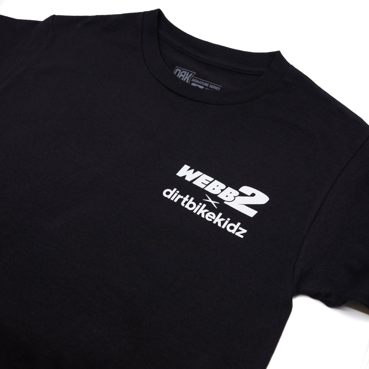 Black T-shirt close-up: crew neck label and WEBB2 dirtbikekidz logo