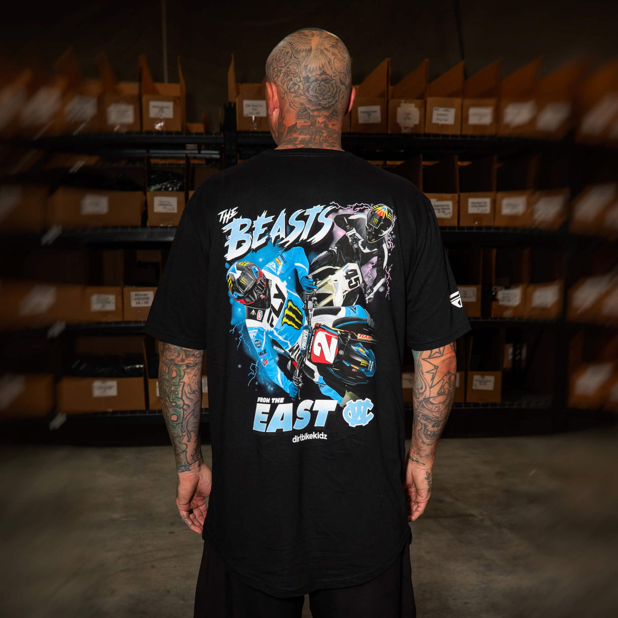 Black T-shirt worn by model with large back “Beasts” “EAST” graphic