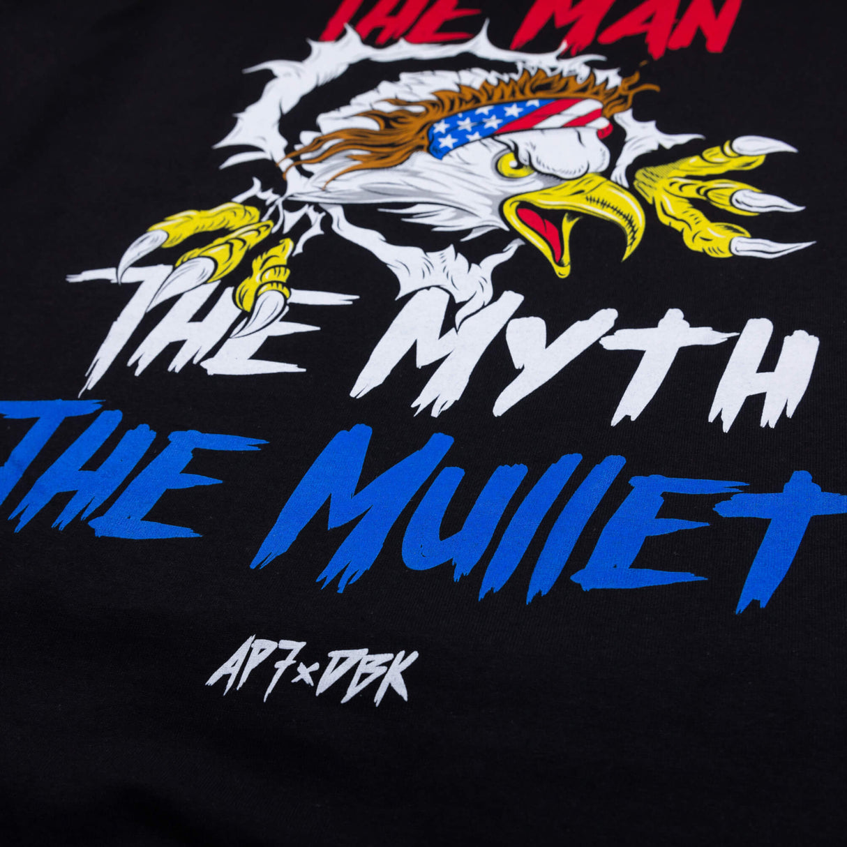 Black graphic T-shirt with eagle, blue/red lettering, and distressed print