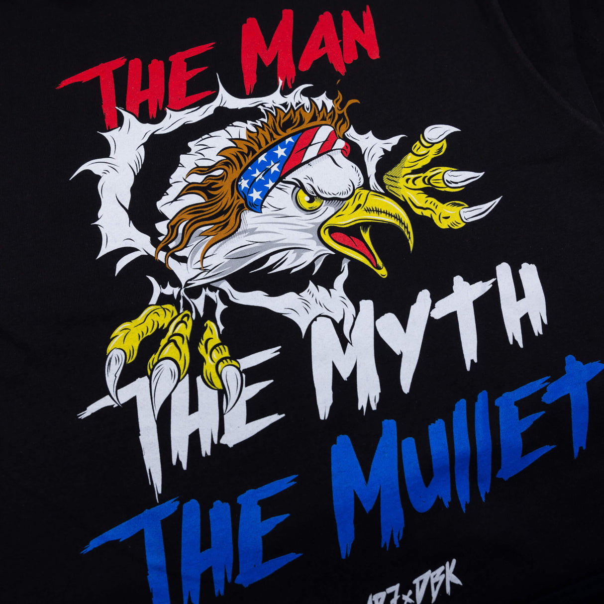 Black graphic T-shirt with eagle head, red THE MAN text, and blue lettering