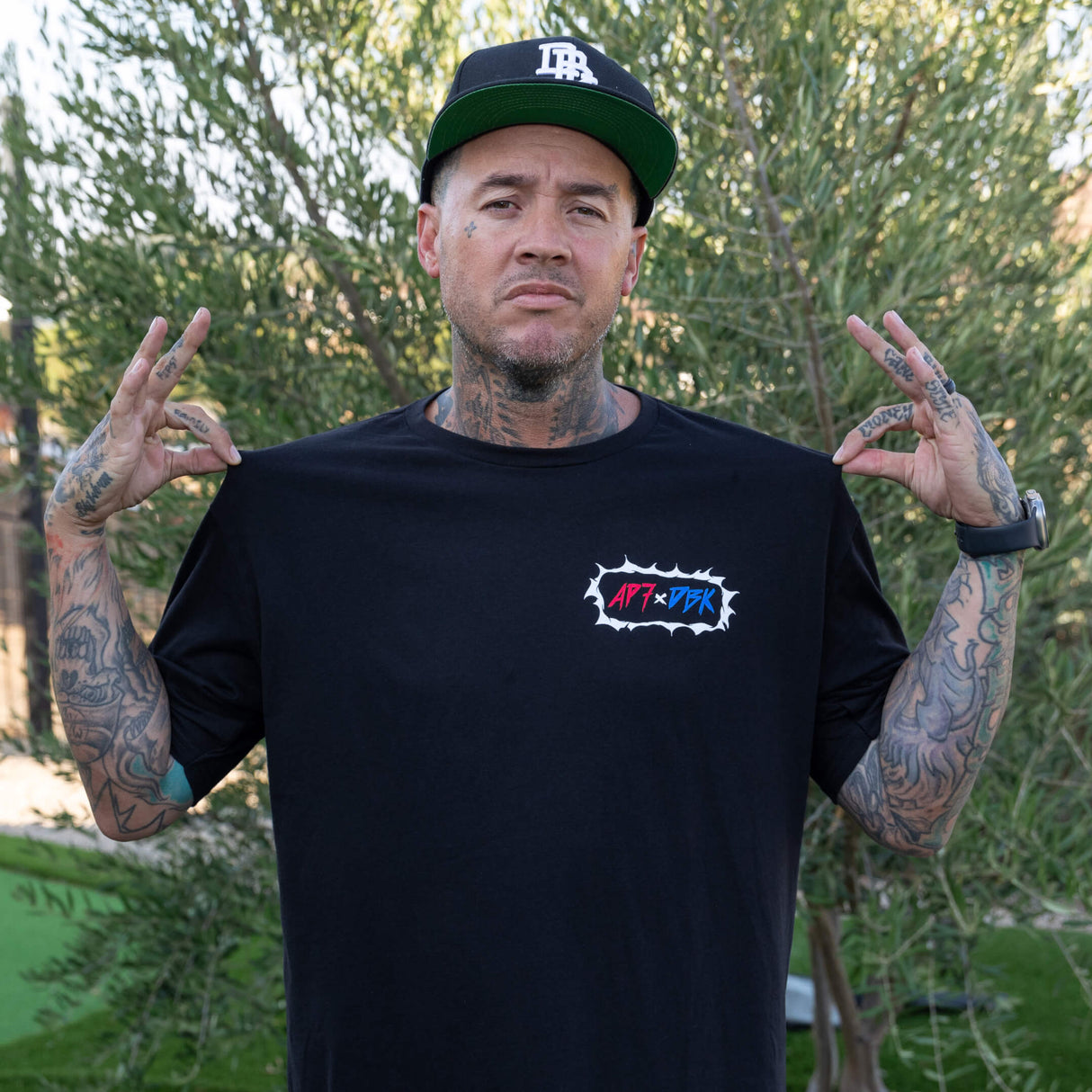 Black crew-neck T-shirt with small front AP7+DBK logo
