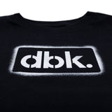 Youth black T-shirt close-up of outlined dbk. logo print