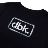 Youth black T-shirt close-up of dbk. logo patch print
