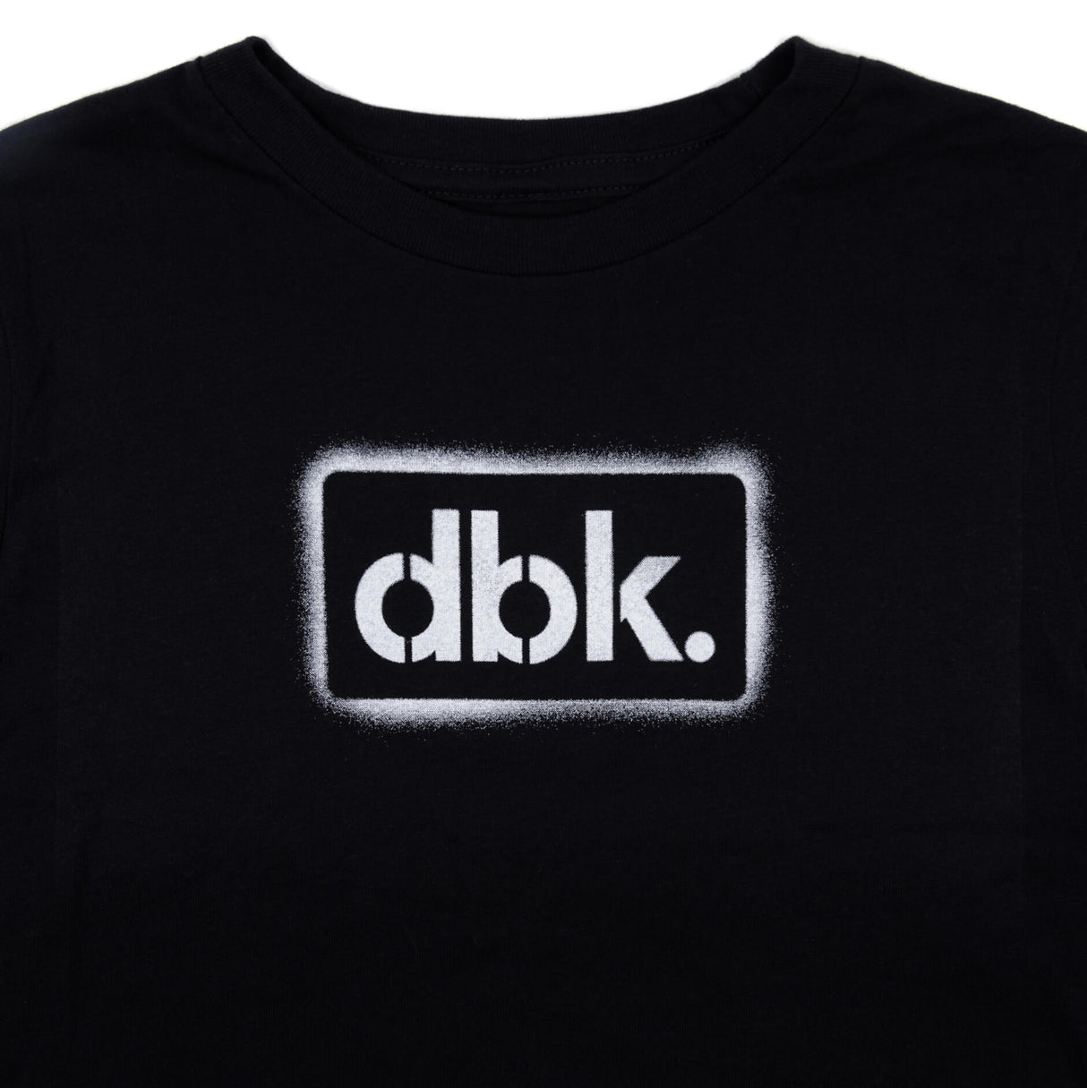Youth black T-shirt close-up of front dbk. logo graphic