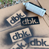 T-shirt stencil set with dbk. logo cutouts on cardboard