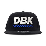 Black snapback cap with large DBK lettering and blue check stripe under it