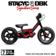 Stacyc Signature Series balance bike, red and black side view with saddle and headlight